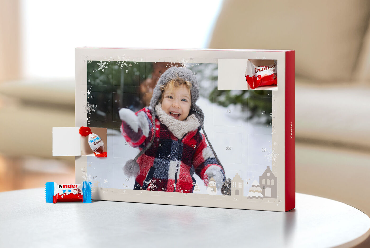 Calendrier de l'Avent personnalisé avec des chocolats kinderŸ et la photo d'un enfant dans la neige
