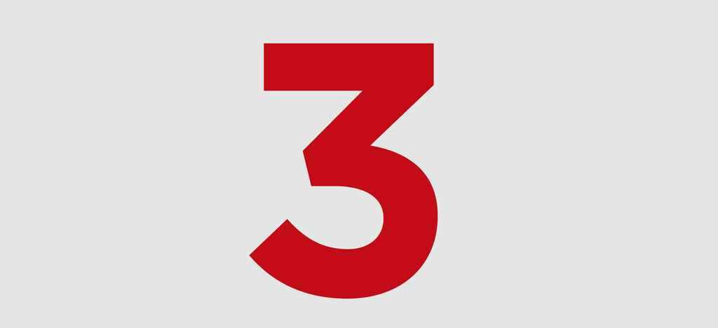 Le chiffre rouge trois sur fond gris