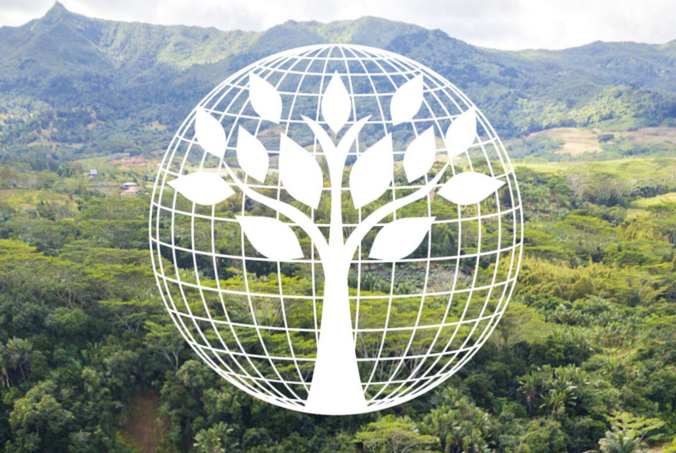 Symboles de la Terre et de l'arbre devant un paysage montagneux.