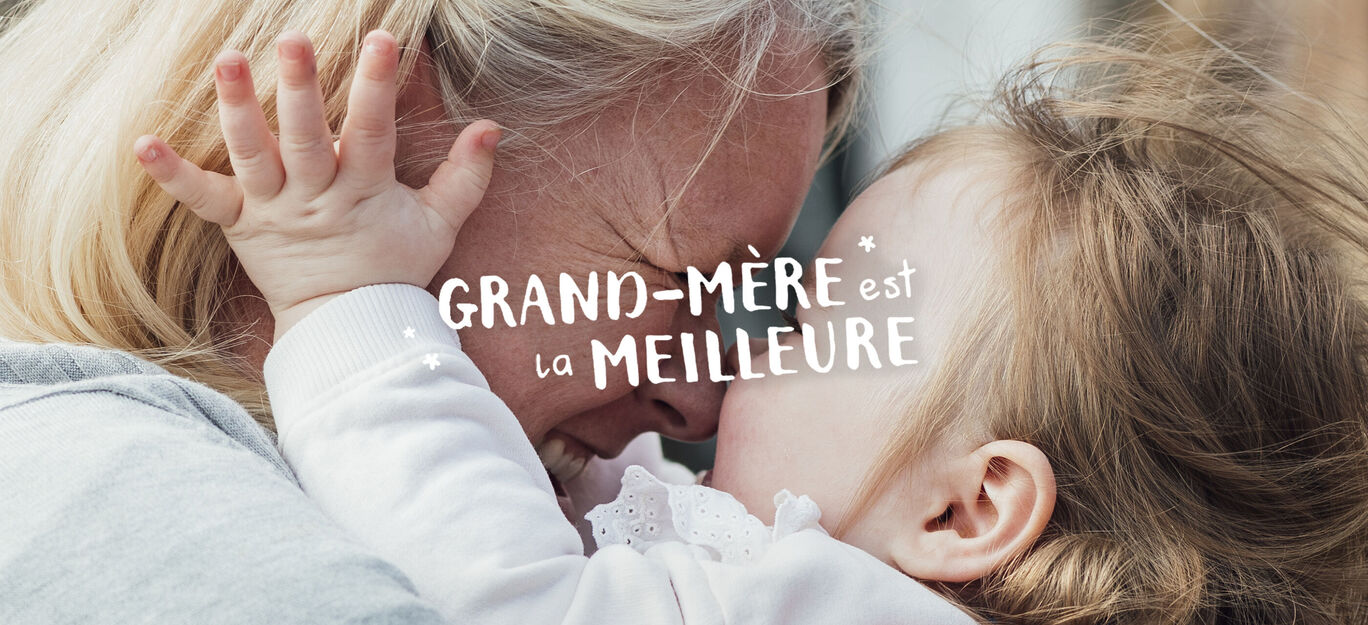 Une étreinte affectueuse entre un adulte et un enfant, rayonnant de joie et de proximité.