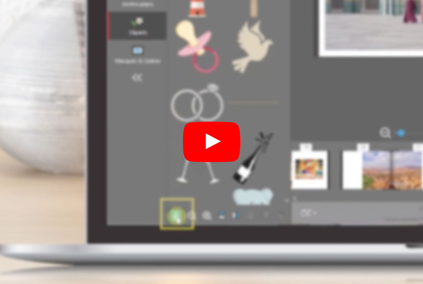 L'écran montre la conception d'un album photo CEWE avec des icônes et un bouton Play pour une vidéo.