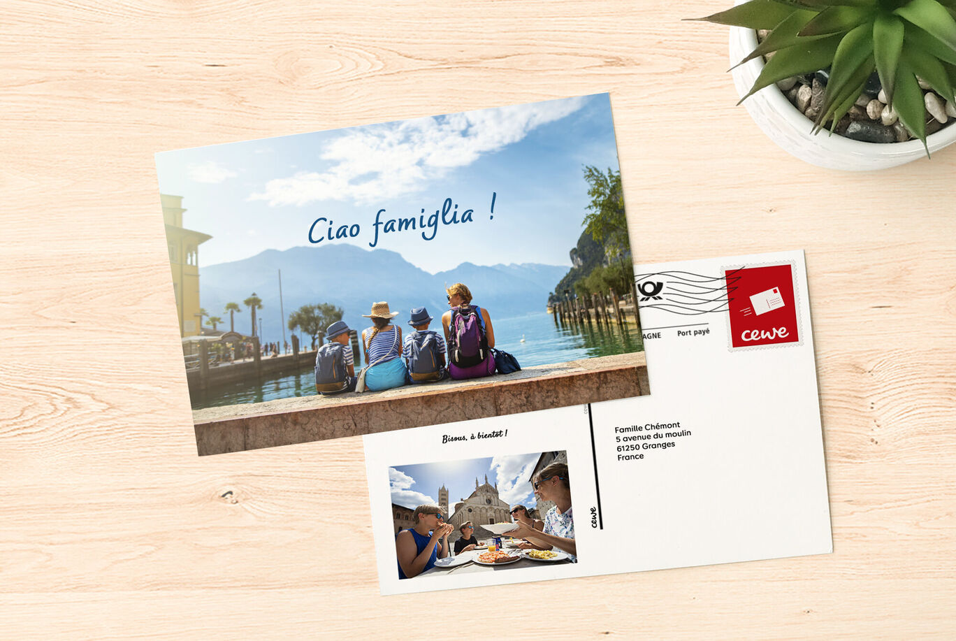 Trois personnes sont au bord de l'eau, admirant les montagnes