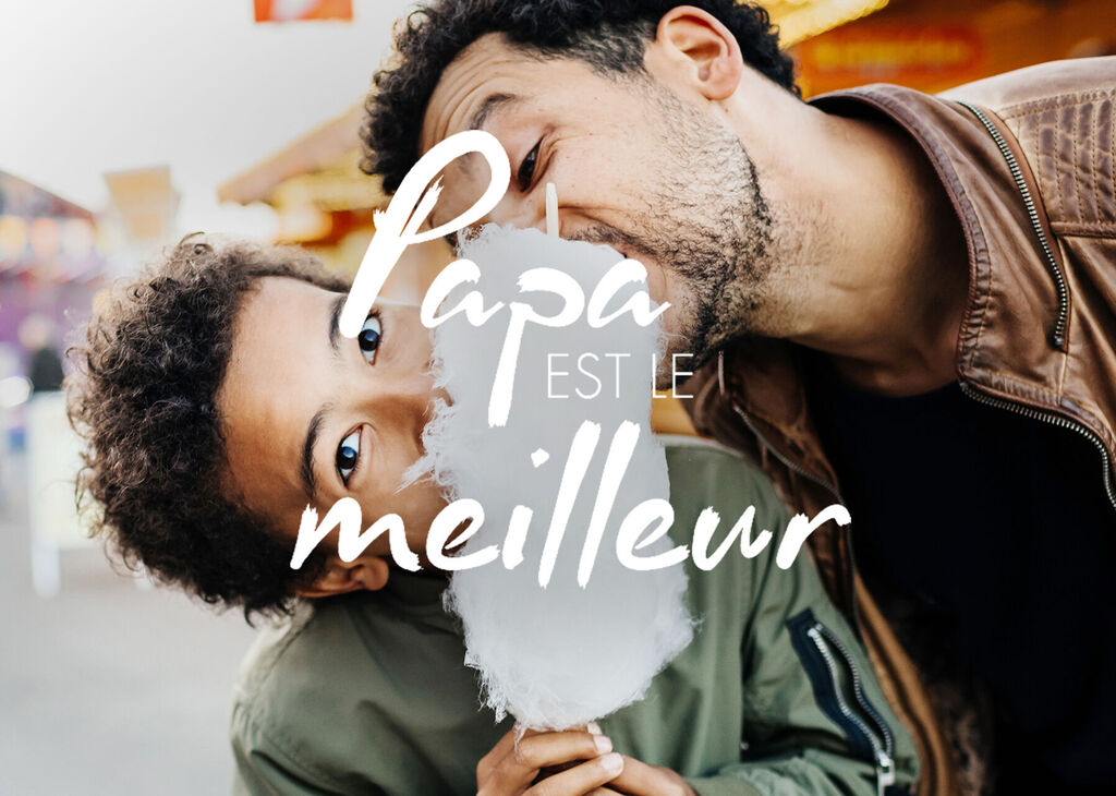 Un couple heureux profite d'une journée à la foire. Ils rient et partagent une grande barbe à papa.