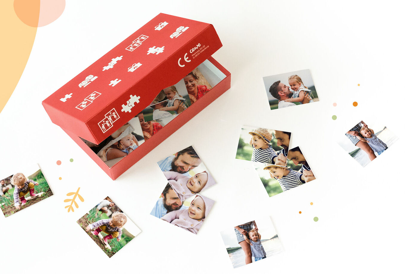 Une boîte rouge ouverte montrant plusieurs photos éparpillées autour. Les images montrent des enfants souriants et des moments familiaux.