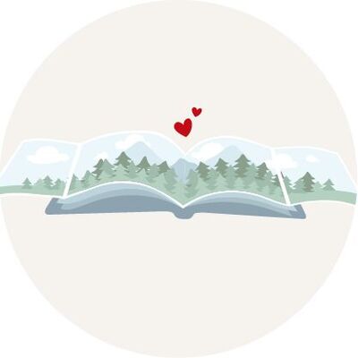 Un album photo ouvert montre un paysage avec montagnes, forêts et des cœurs rouges.