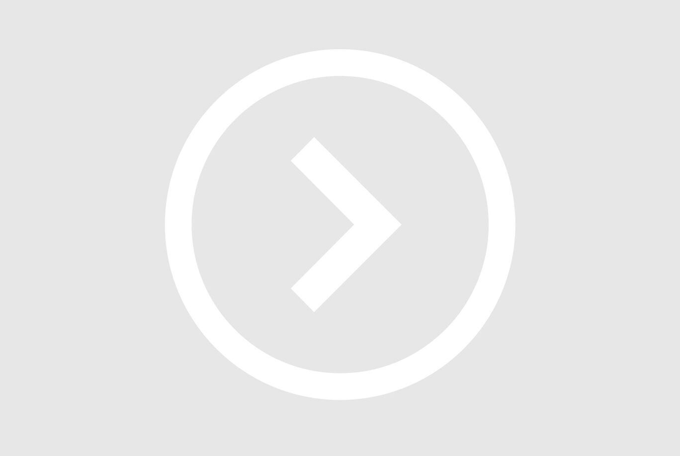 Symbole de flèche gris dans un cadre rond.