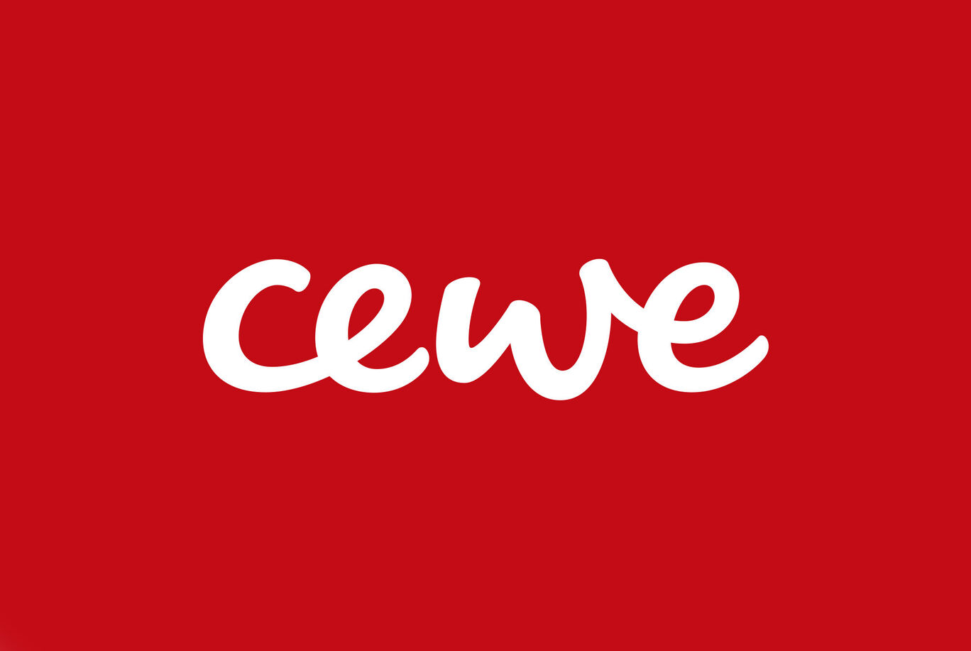 Le logo CEWE sur fond rouge, rayonnant de joie et de créativité.